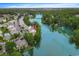 Aerial view of the community showcasing a lake, surrounding homes, and green landscape at 104-4 Gully Branch Ln. # 4, Myrtle Beach, SC 29572
