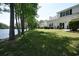 Backyard with a lawn and lake views, featuring patio seating for outdoor relaxation at 104-4 Gully Branch Ln. # 4, Myrtle Beach, SC 29572