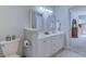 Bright bathroom with a toilet, double vanity and views into the bedroom through an open door at 104-4 Gully Branch Ln. # 4, Myrtle Beach, SC 29572
