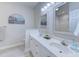 Bathroom featuring double sinks, stylish vanity, framed mirrors, and neutral paint at 104-4 Gully Branch Ln. # 4, Myrtle Beach, SC 29572