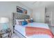 Comfortable bedroom featuring a tufted headboard, soft bedding and decor, with ensuite access at 104-4 Gully Branch Ln. # 4, Myrtle Beach, SC 29572