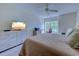 Bright bedroom featuring a light-colored dresser with TV, office space, and comfortable bedding at 104-4 Gully Branch Ln. # 4, Myrtle Beach, SC 29572