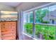 Bright bedroom with a large window overlooking beautiful scenery and a mounted television at 104-4 Gully Branch Ln. # 4, Myrtle Beach, SC 29572