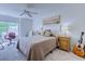 Inviting bedroom featuring neutral colors, a ceiling fan, and a painting over the headboard at 104-4 Gully Branch Ln. # 4, Myrtle Beach, SC 29572