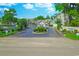 Community entrance featuring well-manicured landscaping and clear signage at 104-4 Gully Branch Ln. # 4, Myrtle Beach, SC 29572