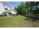 Classic white home with well-maintained lawn and lakeside setting, offering serene views at 104-4 Gully Branch Ln. # 4, Myrtle Beach, SC 29572