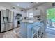 Stylish kitchen with stainless steel appliances, island seating, and an open layout to the backyard at 104-4 Gully Branch Ln. # 4, Myrtle Beach, SC 29572