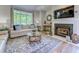 Cozy living room featuring a fireplace, ample natural light, and stylish décor at 104-4 Gully Branch Ln. # 4, Myrtle Beach, SC 29572