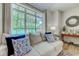 Comfortable living room with lake views, stylish furniture, and ample natural light at 104-4 Gully Branch Ln. # 4, Myrtle Beach, SC 29572