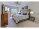 Comfortable main bedroom featuring a large bed, dresser, and a window overlooking a green yard at 104-4 Gully Branch Ln. # 4, Myrtle Beach, SC 29572