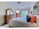 Spacious main bedroom with tufted headboard, dresser, ceiling fan and an exterior view at 104-4 Gully Branch Ln. # 4, Myrtle Beach, SC 29572