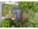 Aerial view of a home nestled among lush greenery, showcasing the roof and surrounding landscape at 106 Azalea Dr., Conway, SC 29526