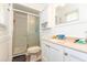 Bright bathroom featuring a shower, white vanity, and a window at 106 Azalea Dr., Conway, SC 29526
