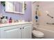 The bathroom has a white vanity, white tile shower and tub, and modern fixtures, ensuring functionality and style at 106 Azalea Dr., Conway, SC 29526
