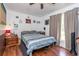 Comfortable bedroom with hardwood floors, a ceiling fan, and a large window at 106 Azalea Dr., Conway, SC 29526