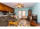 A cozy living room featuring a ceiling fan, comfortable seating, and natural light streaming through the French doors at 106 Azalea Dr., Conway, SC 29526