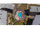 Aerial view of community pool and hot tub, nestled between condo buildings with beach access at 108 N Ocean Blvd. # 301, North Myrtle Beach, SC 29582