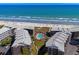 Aerial view of oceanfront condo complex featuring a central pool, beach access, and well-maintained grounds at 108 N Ocean Blvd. # 301, North Myrtle Beach, SC 29582