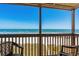 Enjoy oceanfront views from this spacious balcony with seating and scenic landscapes at 108 N Ocean Blvd. # 301, North Myrtle Beach, SC 29582