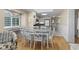 Bright dining area features a modern table with seating and an ocean view from the adjacent window at 108 N Ocean Blvd. # 301, North Myrtle Beach, SC 29582