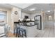 Kitchen with white cabinets, stainless steel appliances, and a granite countertop island with barstool seating at 108 N Ocean Blvd. # 301, North Myrtle Beach, SC 29582