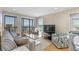Ocean front living room with balcony access and comfortable furnishings at 108 N Ocean Blvd. # 301, North Myrtle Beach, SC 29582