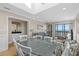 Open-concept living and dining area with a wet bar, beach view, and comfortable seating at 108 N Ocean Blvd. # 301, North Myrtle Beach, SC 29582