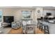 Inviting living space with an adjacent kitchen, and an ocean view window at 108 N Ocean Blvd. # 301, North Myrtle Beach, SC 29582