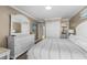 Main bedroom with bright natural light and white furniture at 108 N Ocean Blvd. # 301, North Myrtle Beach, SC 29582