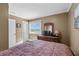 Relaxing bedroom with a TV, dresser and window offering ocean views with access to ensuite at 108 N Ocean Blvd. # 301, North Myrtle Beach, SC 29582