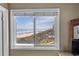 Bright room with an ocean view through a window looking out at a sandy beach and blue ocean at 108 N Ocean Blvd. # 301, North Myrtle Beach, SC 29582