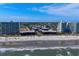 Wide aerial shot of the oceanfront property, beach and building complex at 108 N Ocean Blvd. # 308, North Myrtle Beach, SC 29582