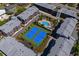 Aerial view showcasing condo buildings with a pool and tennis courts for outdoor activities at 108 N Ocean Blvd. # 308, North Myrtle Beach, SC 29582
