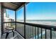 A screened-in balcony offers pristine ocean views and a tranquil seating area at 108 N Ocean Blvd. # 308, North Myrtle Beach, SC 29582