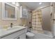 Bathroom features tub with shower, white vanity, updated lighting, and neutral walls at 108 N Ocean Blvd. # 308, North Myrtle Beach, SC 29582