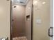 A renovated bathroom features a glass shower stall, neutral tile, and updated fixtures at 108 N Ocean Blvd. # 308, North Myrtle Beach, SC 29582