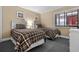 Bright bedroom offers twin beds, neutral walls and decor, and a large window at 108 N Ocean Blvd. # 308, North Myrtle Beach, SC 29582
