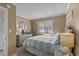 Cozy main bedroom with soft light features a dresser with a TV and a queen bed at 108 N Ocean Blvd. # 308, North Myrtle Beach, SC 29582