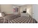 Neutral bedroom with two twin beds, a light dresser and soft natural light at 108 N Ocean Blvd. # 308, North Myrtle Beach, SC 29582