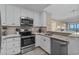 Kitchen featuring granite counters, subway tile backsplash and stainless steel appliances at 108 N Ocean Blvd. # 308, North Myrtle Beach, SC 29582