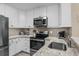 Kitchen featuring granite countertops, stainless appliances, and white cabinets at 108 N Ocean Blvd. # 308, North Myrtle Beach, SC 29582