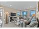 Inviting living room with ocean views, modern entertainment center, and comfortable seating at 108 N Ocean Blvd. # 308, North Myrtle Beach, SC 29582