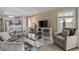Open-concept living area features modern furnishings and direct access to the kitchen and dining area at 108 N Ocean Blvd. # 308, North Myrtle Beach, SC 29582