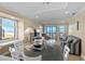 Bright living area with ocean views, a modern glass table, and comfortable seating at 108 N Ocean Blvd. # 308, North Myrtle Beach, SC 29582