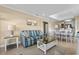 Cozy living area with comfortable striped sofa, accent lighting, and modern decor leading to dining at 108 N Ocean Blvd. # 308, North Myrtle Beach, SC 29582