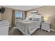 Serene main bedroom with ocean view, and calm coastal-inspired decorations at 108 N Ocean Blvd. # 308, North Myrtle Beach, SC 29582