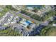 Aerial view of the community with a pool, and a beautiful wooded area at 10970 Highway 90 # A5, Little River, SC 29566