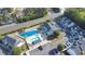 Aerial view of condos with community pool, pond, and ample parking at 10970 Highway 90 # A5, Little River, SC 29566