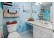 Bright bathroom featuring towels on shelves, tiled floors, and vanity at 10970 Highway 90 # A5, Little River, SC 29566