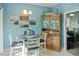 Dining room with seating for four, a decorative hutch, and beach-themed decor at 10970 Highway 90 # A5, Little River, SC 29566